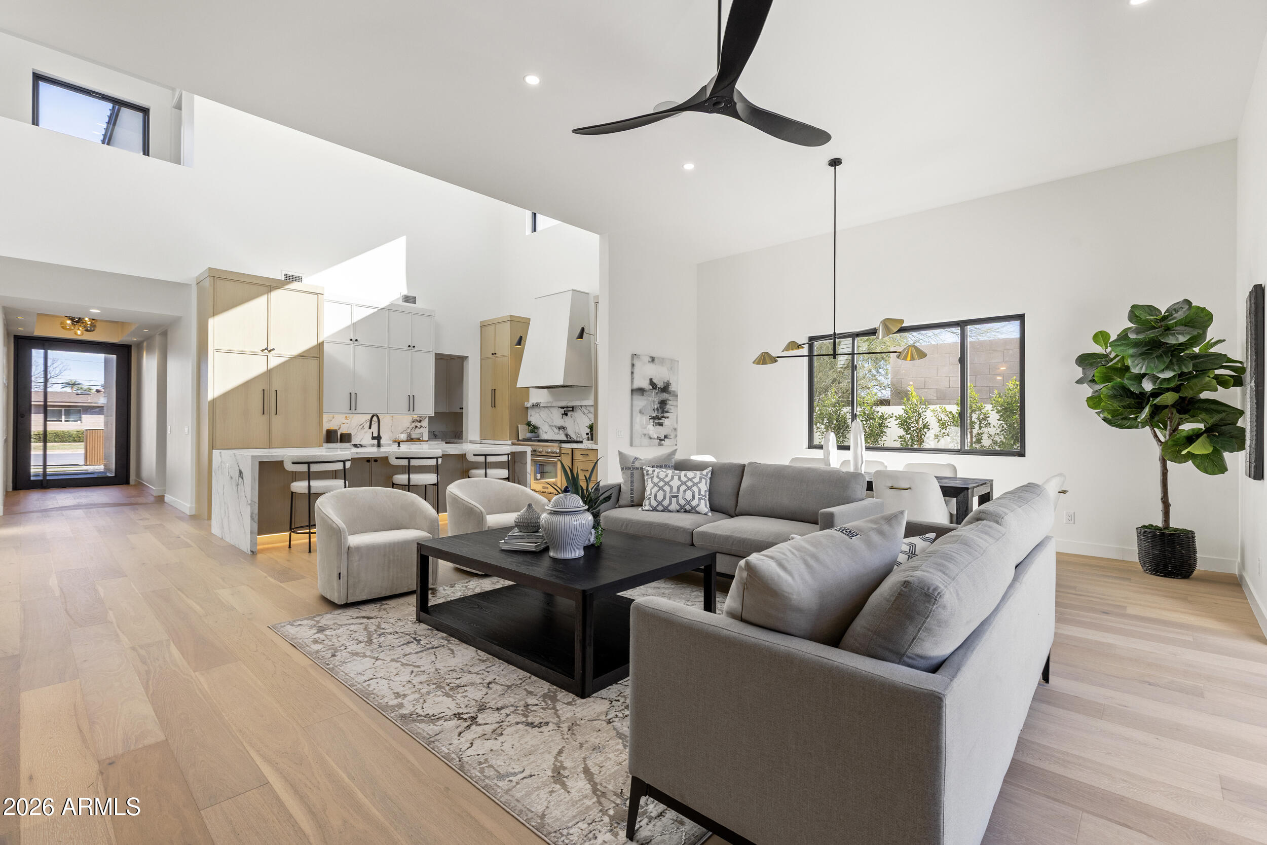 4234 North 42nd Place Phoenix, AZ 85018 - Photo 18 of 78 a living room with furniture kitchen view and a large window