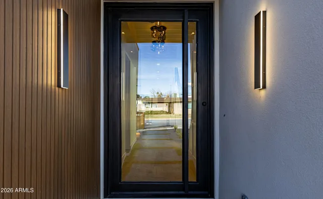 a large white kitchen with a large window