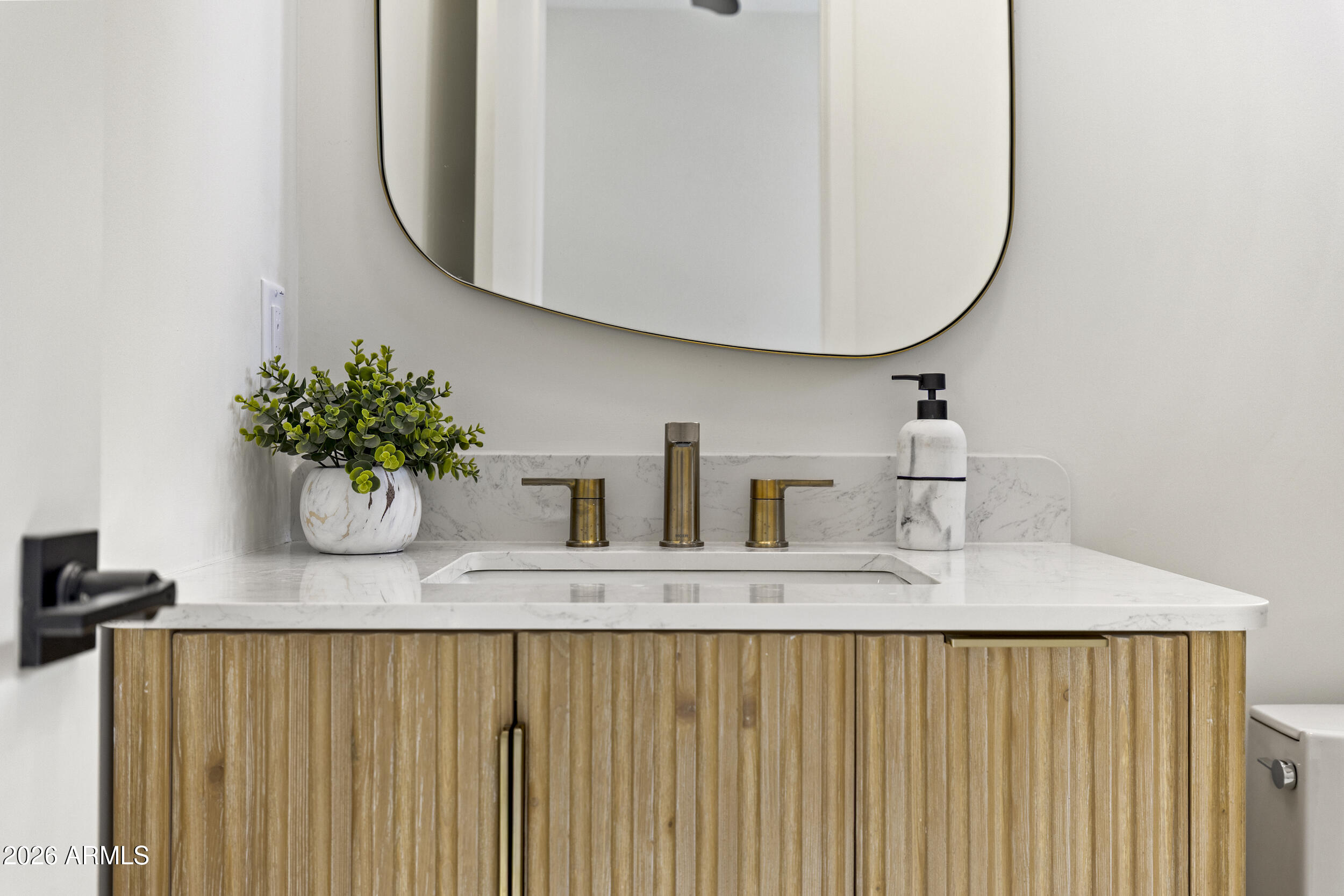 4234 North 42nd Place Phoenix, AZ 85018 - Photo 47 of 78 a bathroom with a sink a mirror and vanity