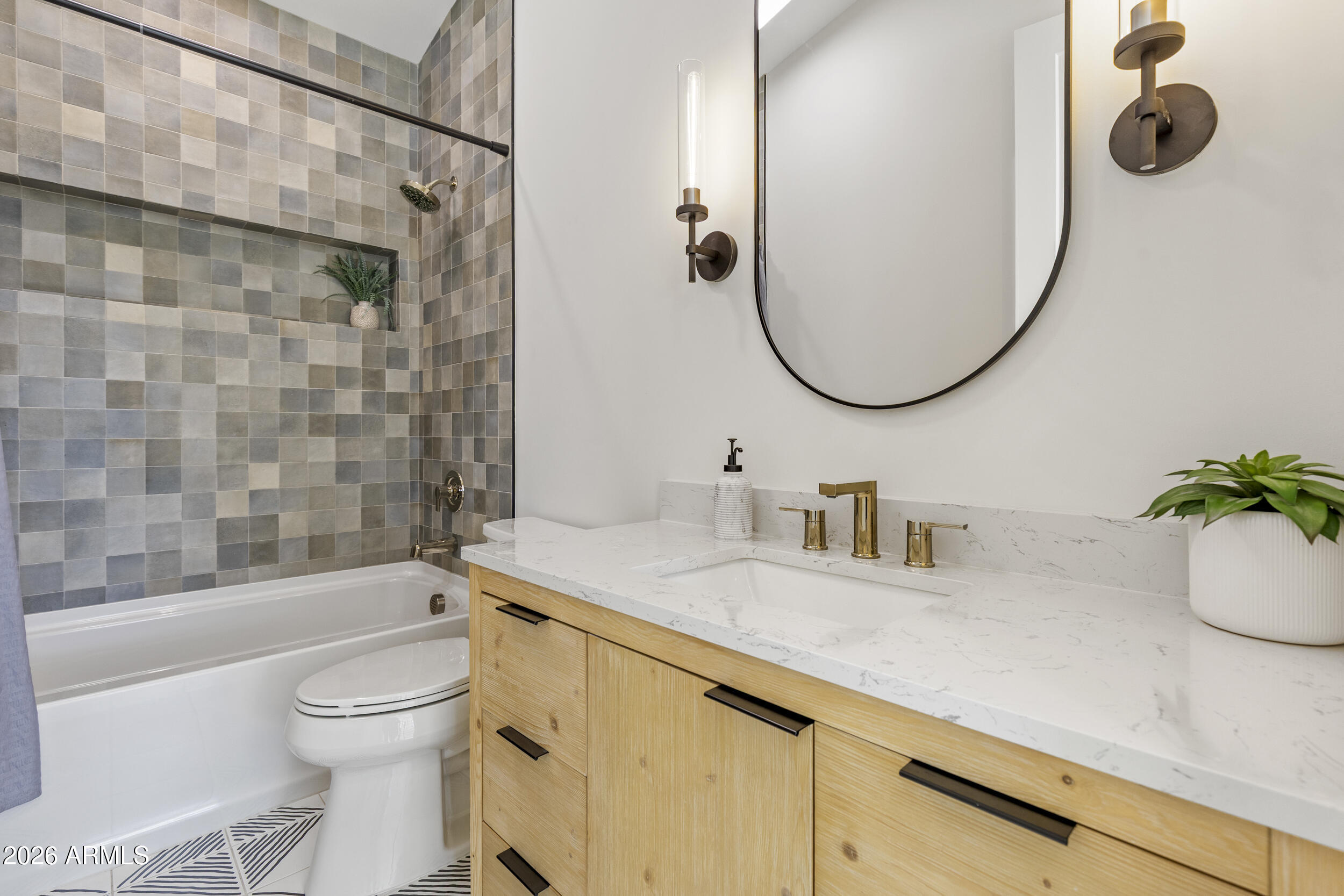 4234 North 42nd Place Phoenix, AZ 85018 - Photo 57 of 78 a bathroom with a sink a toilet and a mirror