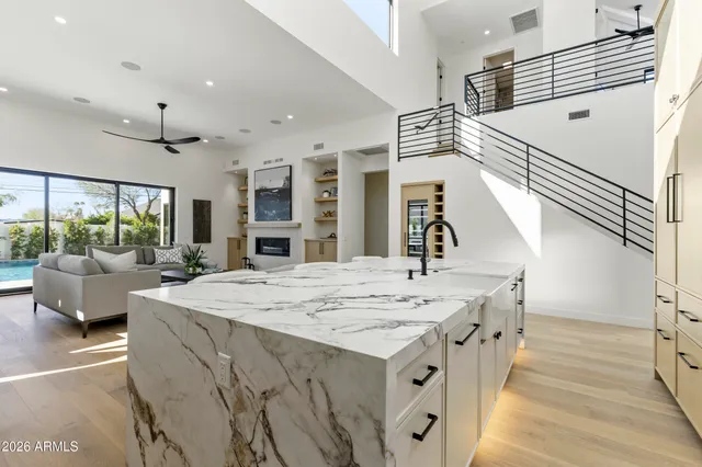 a bathroom with a double vanity sink mirror and
