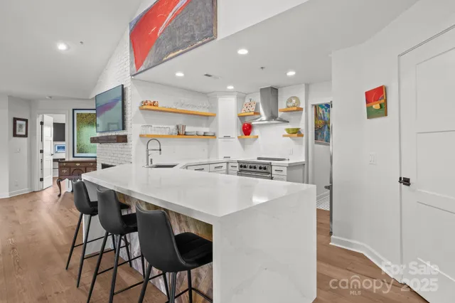 a view of kitchen with cabinets and wooden floor