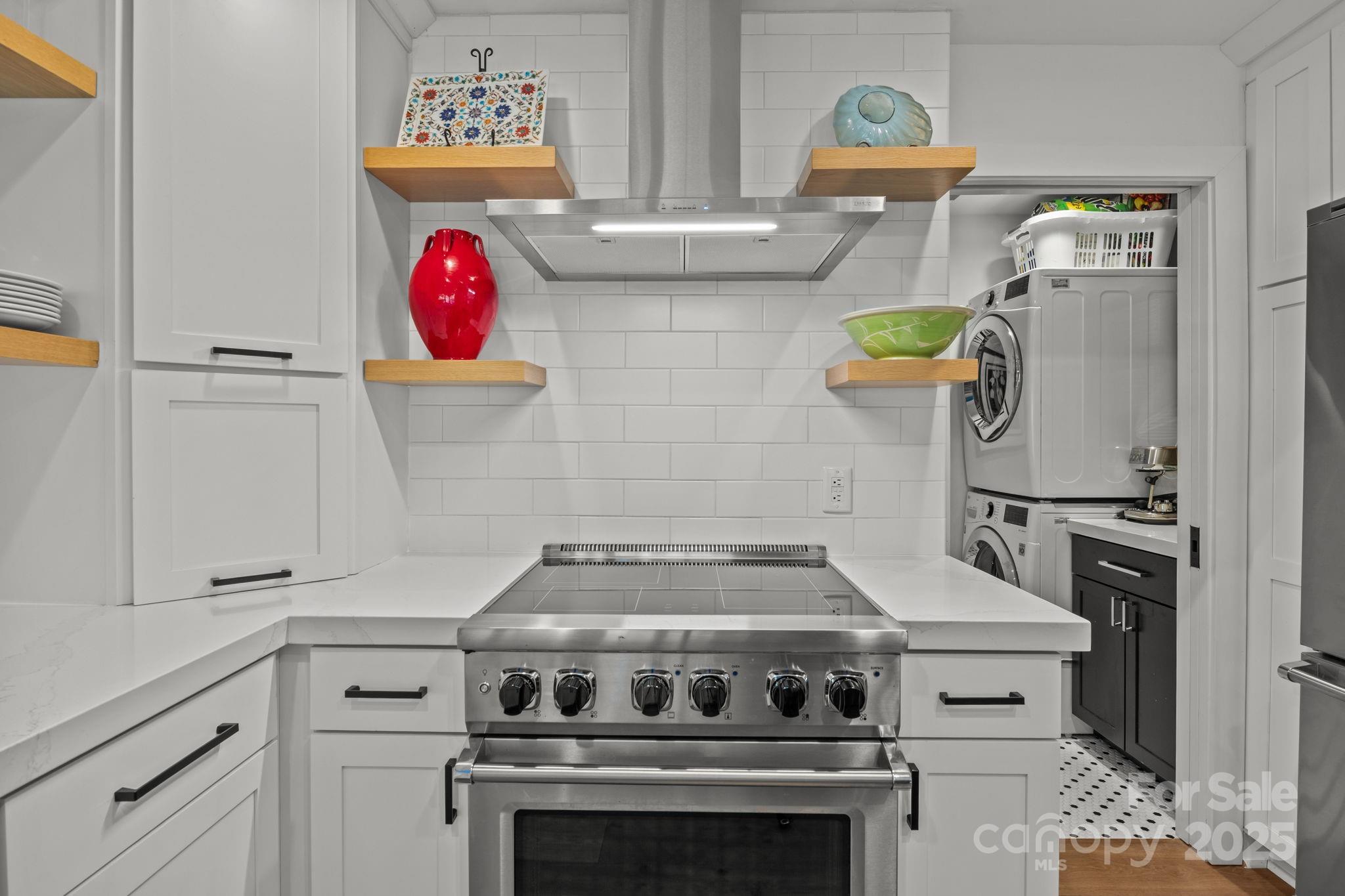 950 Jetton Street, Unit 3 Davidson, NC 28036 - Photo 15 of 29 a stove top oven sitting inside of a kitchen