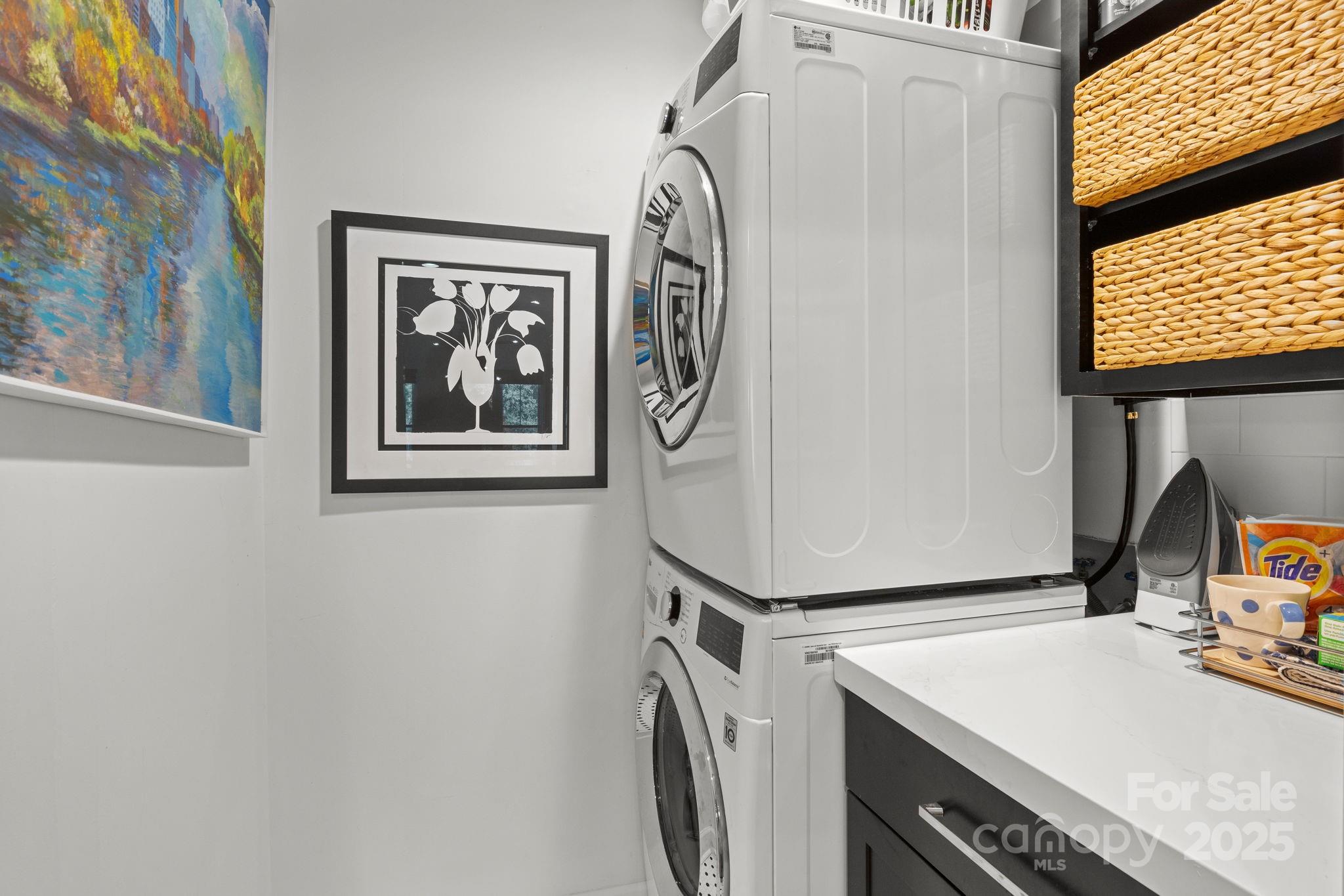 950 Jetton Street, Unit 3 Davidson, NC 28036 - Photo 17 of 29 a utility room with a window wooden floor and washer