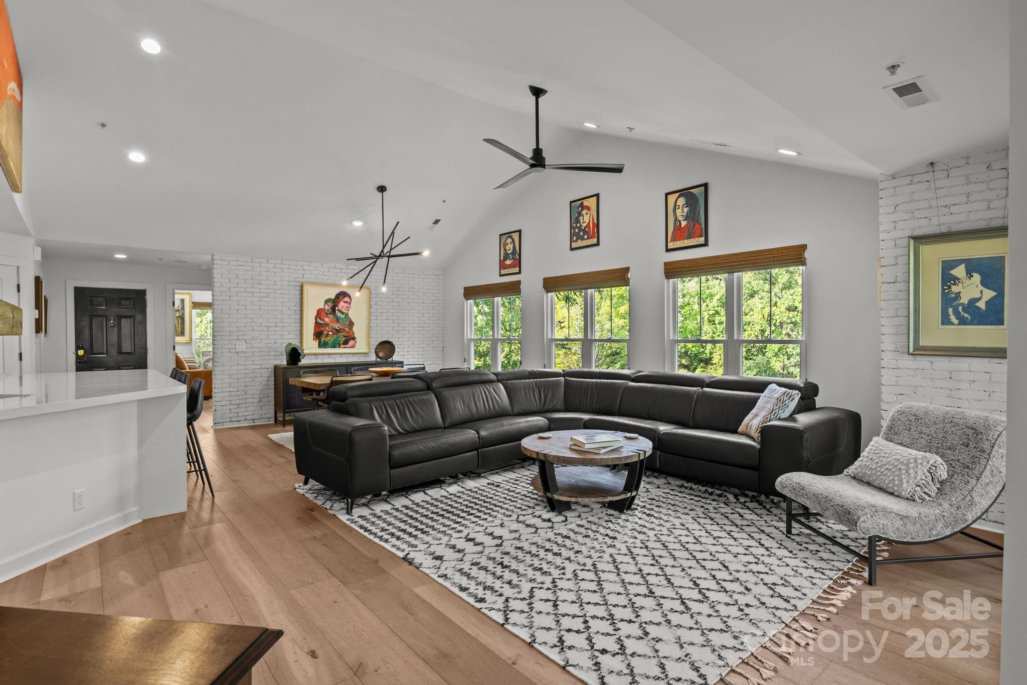 950 Jetton Street, Unit 3 Davidson, NC 28036 - Photo 19 of 29 a living room with furniture and a large window