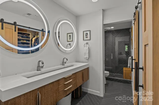 a bathroom with a shower and a sink