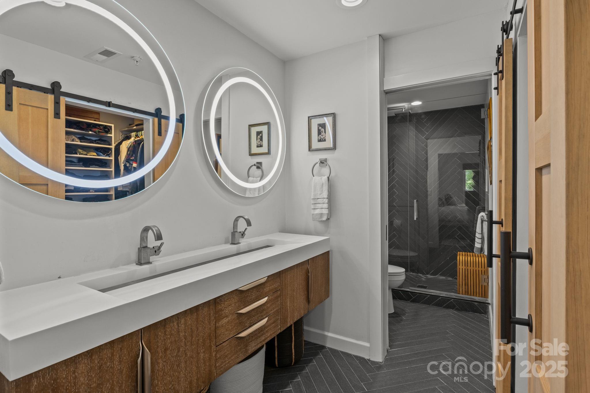 950 Jetton Street, Unit 3 Davidson, NC 28036 - Photo 23 of 29 a bathroom with a sink and a mirror