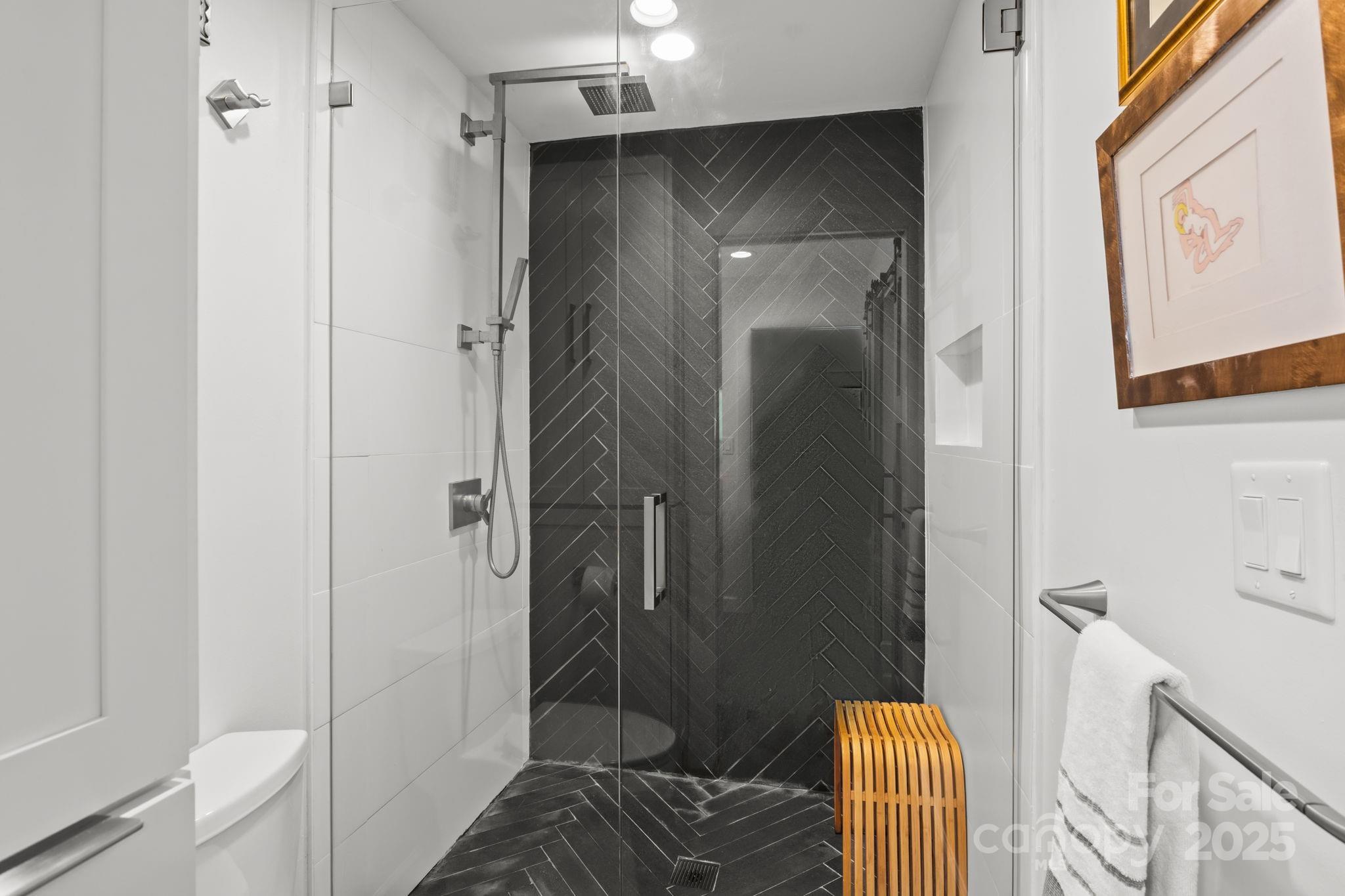 950 Jetton Street, Unit 3 Davidson, NC 28036 - Photo 24 of 29 a bathroom with a shower and a sink