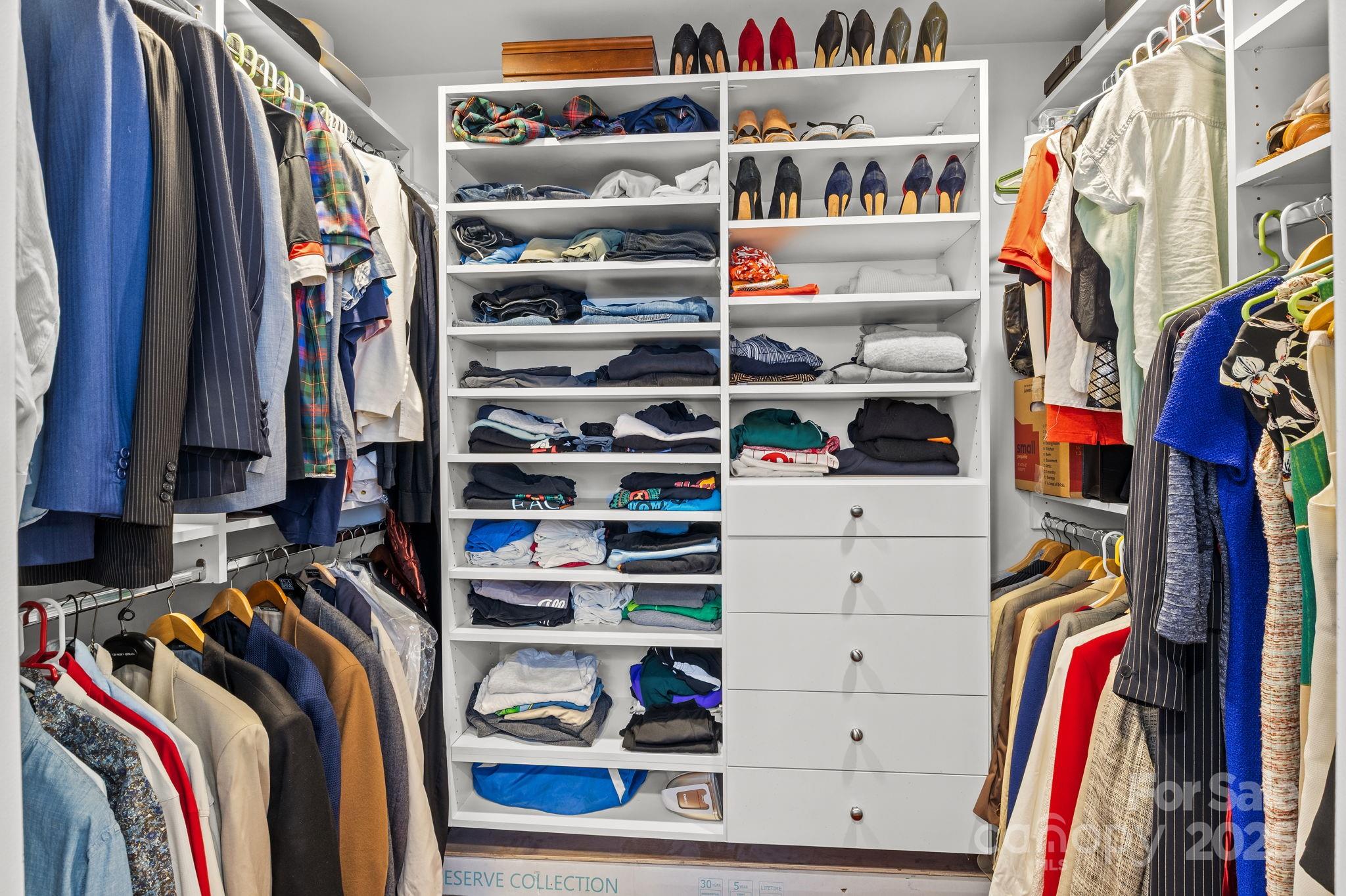 950 Jetton Street, Unit 3 Davidson, NC 28036 - Photo 25 of 29 a view of walk in closet with clothes and shoes