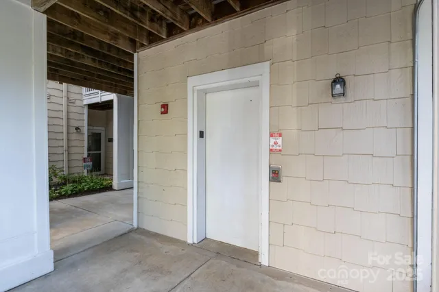 an aerial view of residential houses with outdoor space and lake view