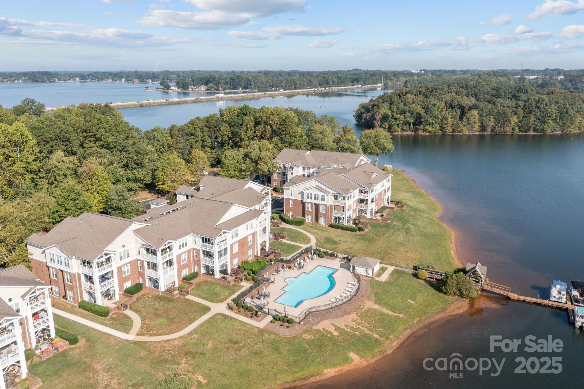 950 Jetton Street, Unit 3 Davidson, NC 28036 - Photo 27 of 29 an aerial view of residential houses with outdoor space and lake view