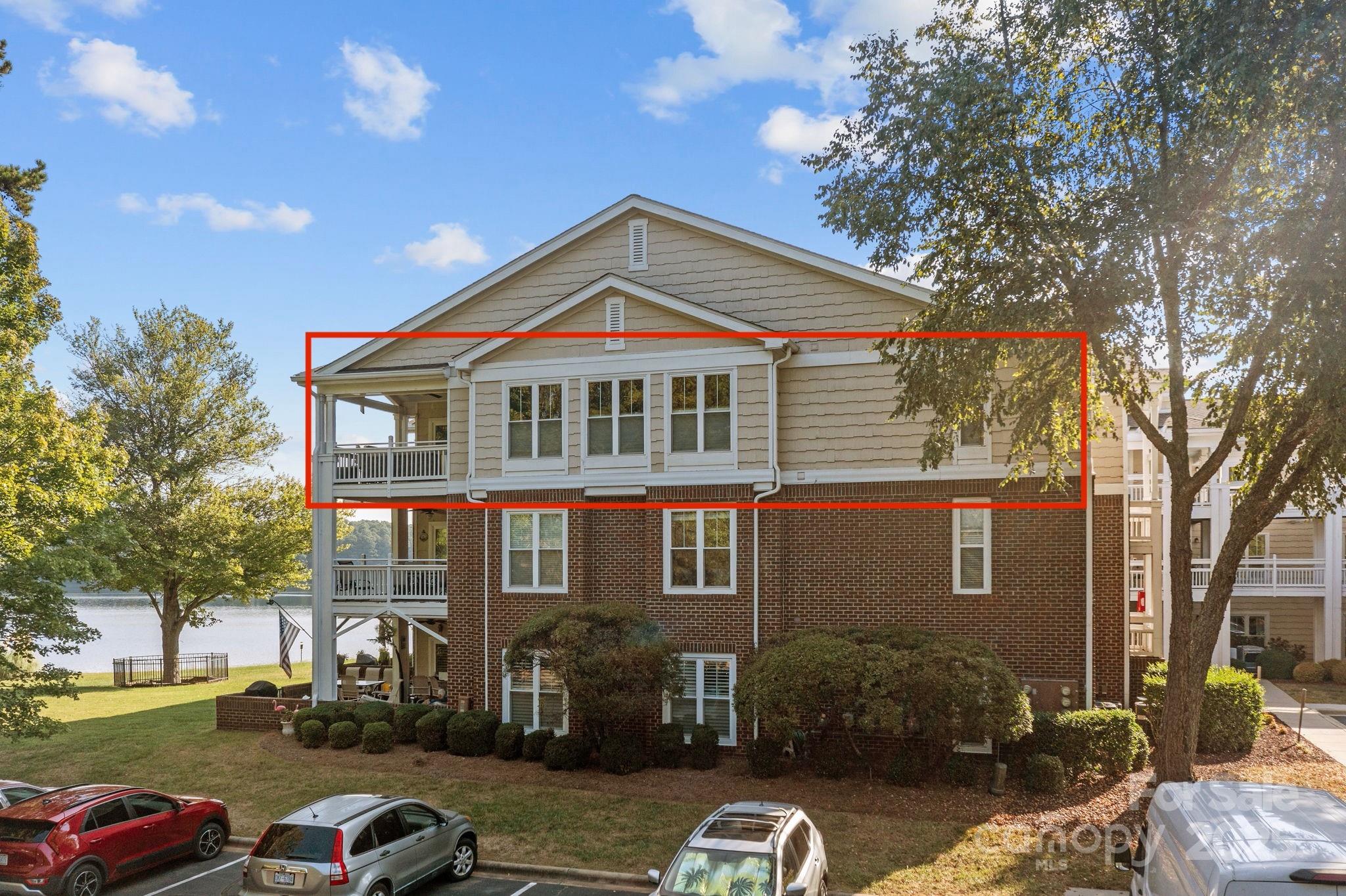 950 Jetton Street, Unit 3 Davidson, NC 28036 - Photo 3 of 29 a front view of a house with a yard