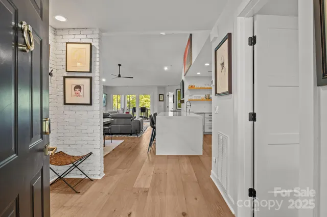 a view of a living room and a wooden floor