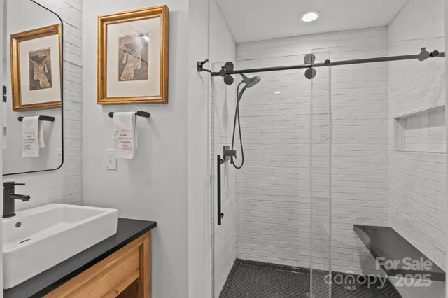 a bathroom with a sink and a shower