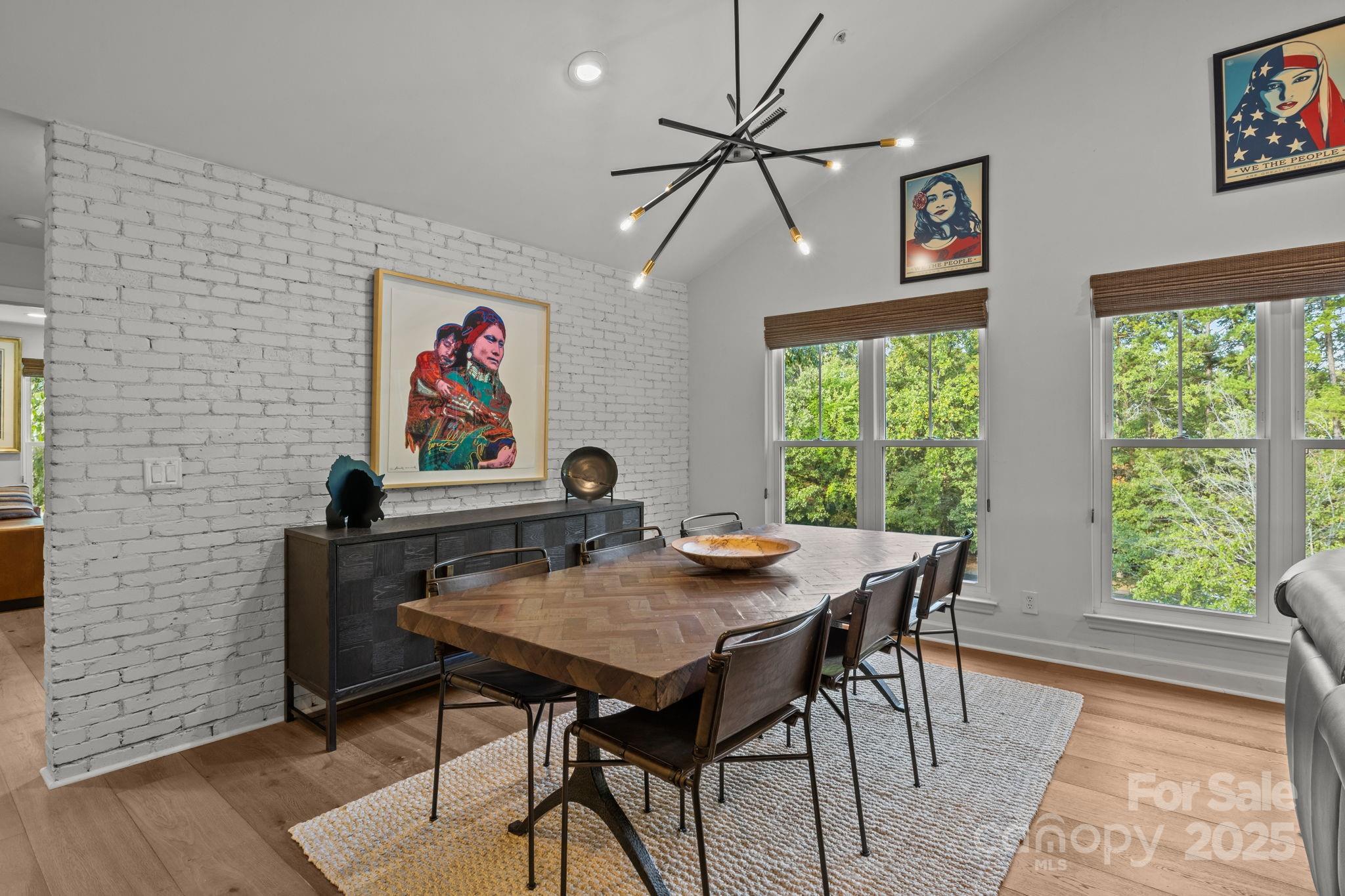 950 Jetton Street, Unit 3 Davidson, NC 28036 - Photo 9 of 29 a view of a dining room with furniture window and wooden floor