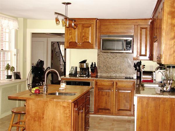 53 Wilder Road Sterling, MA 01564 - Photo 2 of 23 a kitchen with a sink and a refrigerator