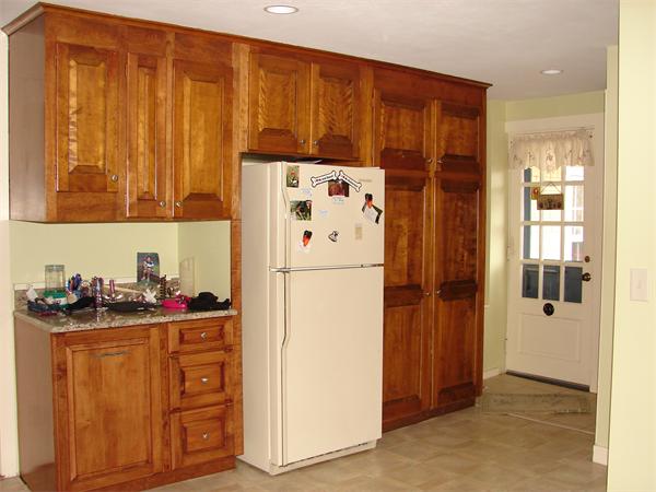 53 Wilder Road Sterling, MA 01564 - Photo 4 of 23 a white refrigerator freezer sitting in a kitchen