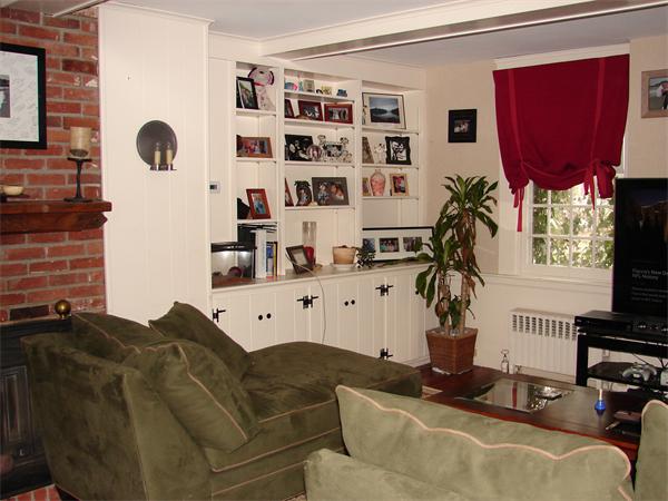 53 Wilder Road Sterling, MA 01564 - Photo 6 of 23 a living room with furniture cabinets and a potted plant