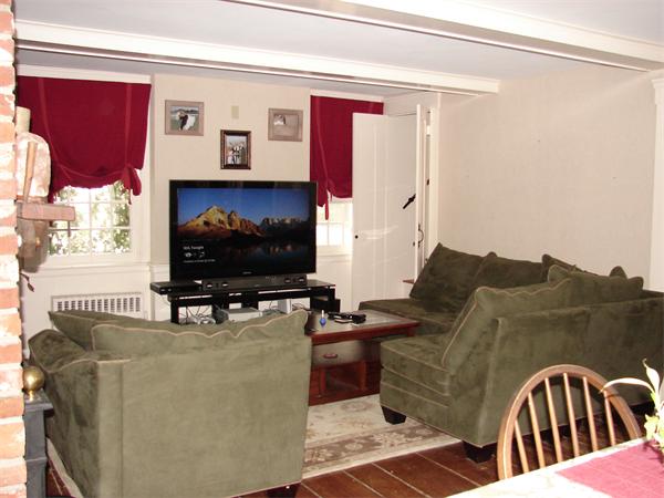 53 Wilder Road Sterling, MA 01564 - Photo 7 of 23 a living room with furniture and a flat screen tv