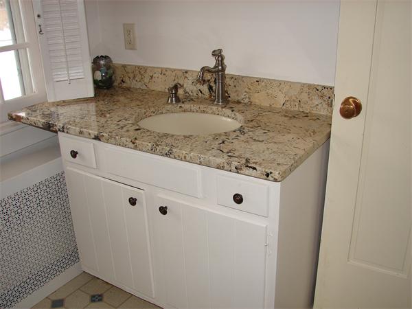 53 Wilder Road Sterling, MA 01564 - Photo 9 of 23 a bathroom with a granite countertop sink and vanity