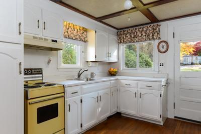 79 Old Farm Road Centerville, MA 02632 - Photo 8 of 17 a kitchen with a stove a sink and a microwave