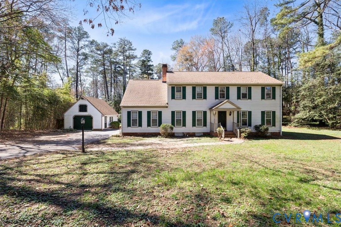 11716 Ivywood Road Chester, VA 23831 - Photo 1 of 38 a house with swimming pool in front of it