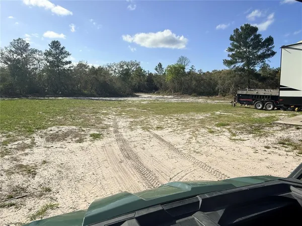 a view of a lake from a yard