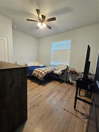 a bedroom with furniture and a window
