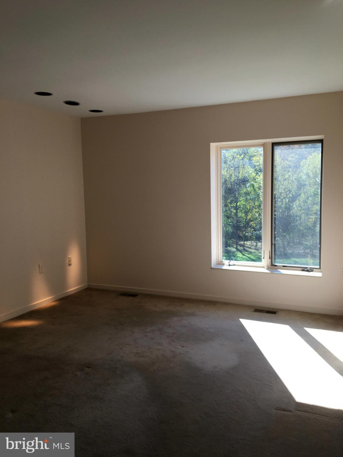 2331 Old Court Road, Unit 400 Baltimore, MD 21208 - Photo 15 of 27 a view of an empty room with a window