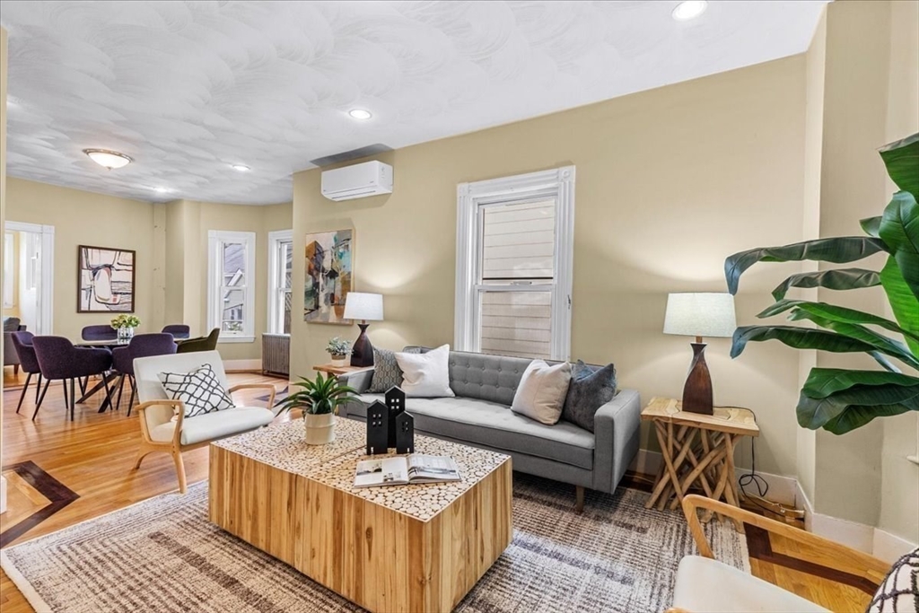 a living room with furniture and a table