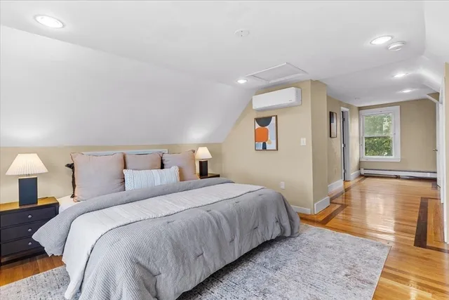 a bedroom with bed and a night stand