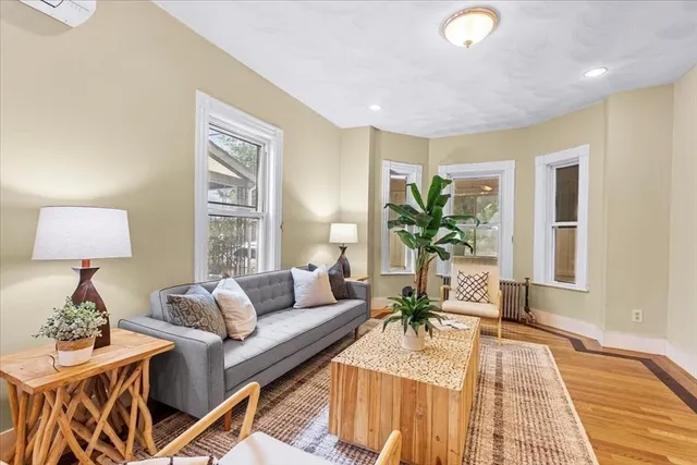 a living room with furniture and a lamp
