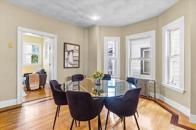 a dining room with furniture and window