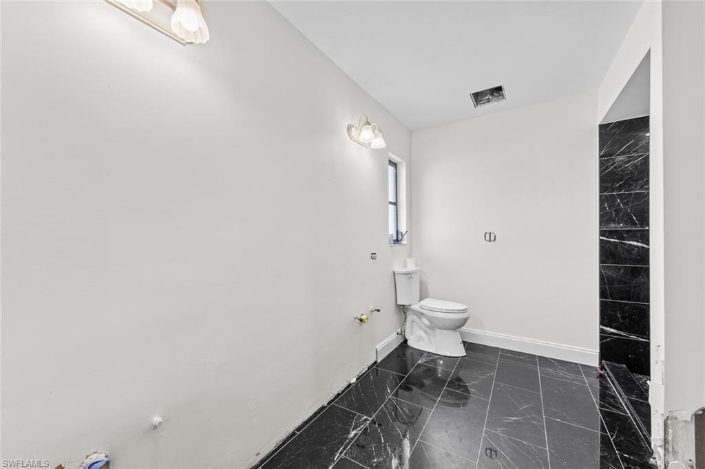 17452 Braddock Road Fort Myers, FL 33967 - Photo 29 of 38 Bathroom featuring toilet
