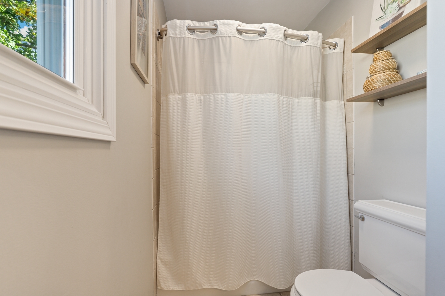 350 Pearson Circle Naperville, IL 60563 - Photo 18 of 32 a bathroom with a shower curtain and a toilet