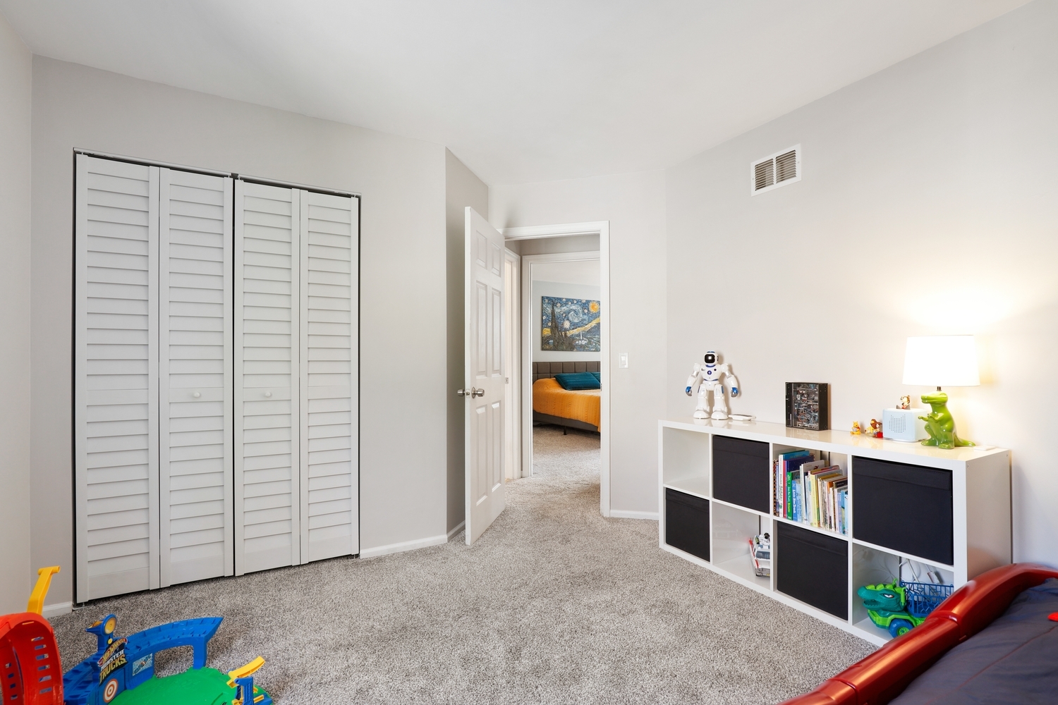350 Pearson Circle Naperville, IL 60563 - Photo 22 of 32 a view of a bedroom with baby crib and cabinet
