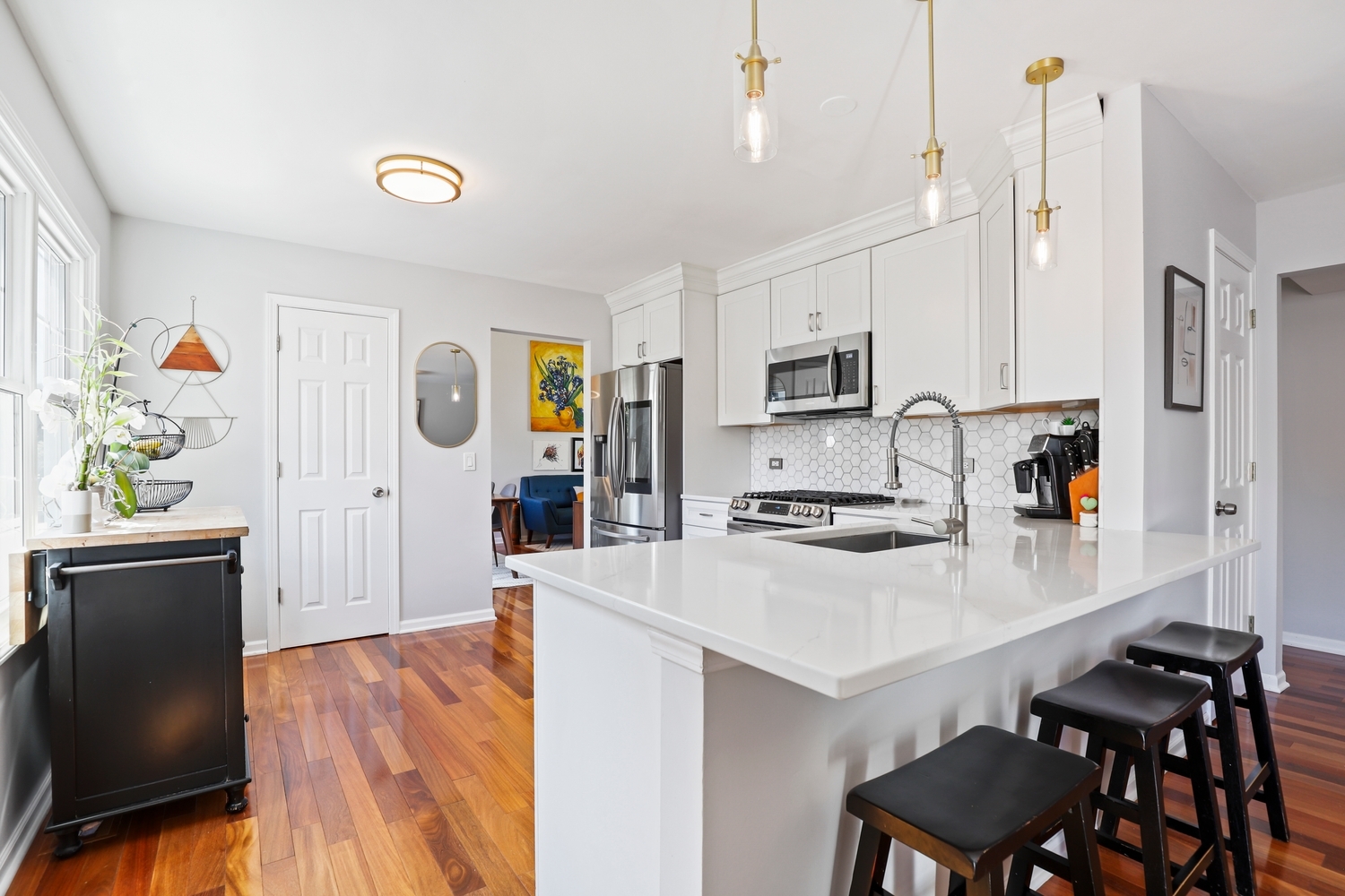 350 Pearson Circle Naperville, IL 60563 - Photo 8 of 32 a kitchen with stainless steel appliances a stove a sink dishwasher a refrigerator white cabinets and wooden floor