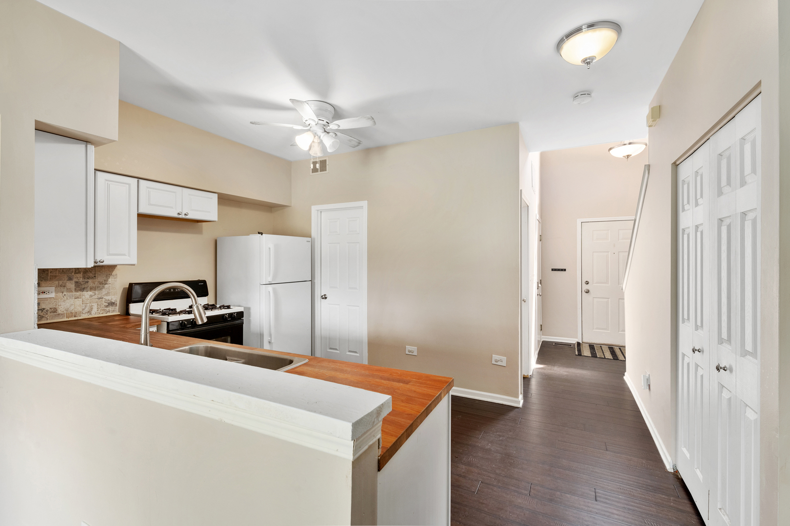2427 Oak Tree Lane Plainfield, IL 60586 - Photo 13 of 24 a kitchen view with white cabinets and stainless steel appliances