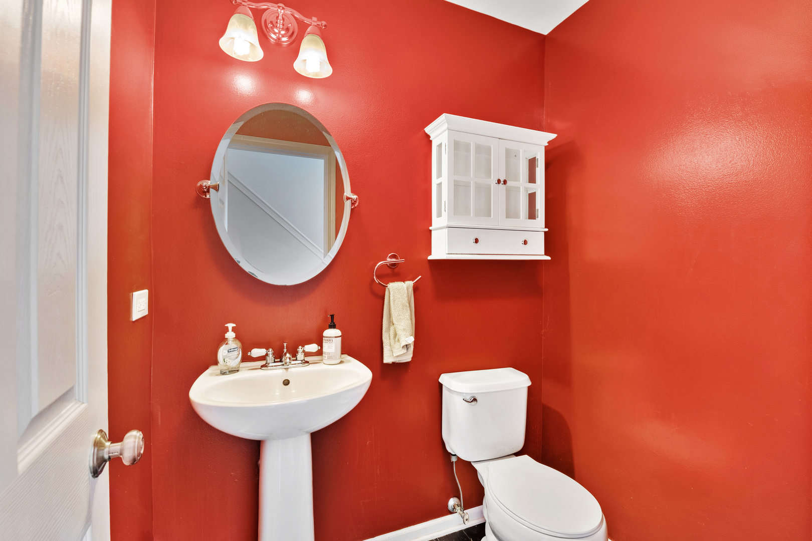 2427 Oak Tree Lane Plainfield, IL 60586 - Photo 14 of 24 a bathroom with a toilet sink and mirror