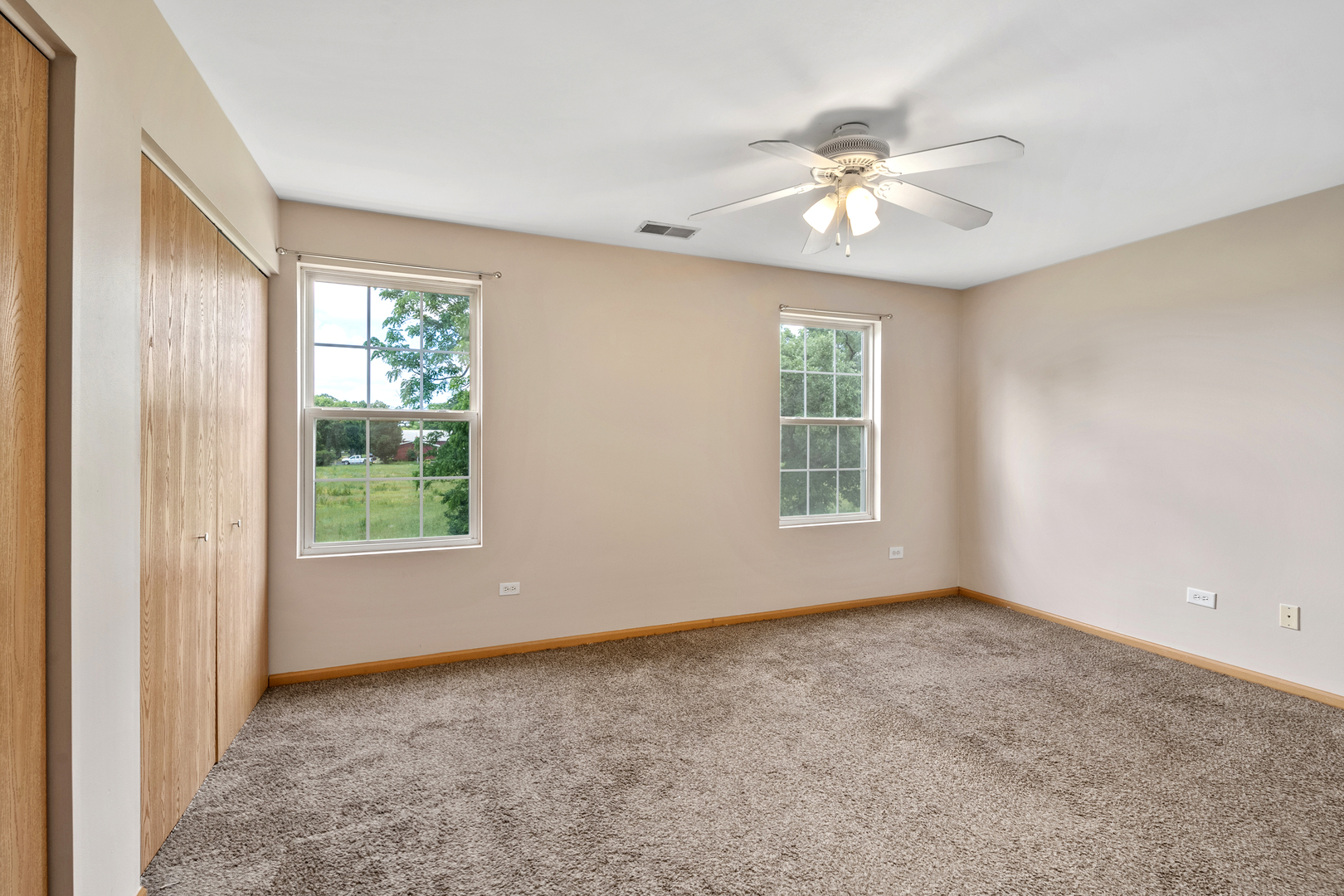 2427 Oak Tree Lane Plainfield, IL 60586 - Photo 21 of 24 a view of an empty room with a window