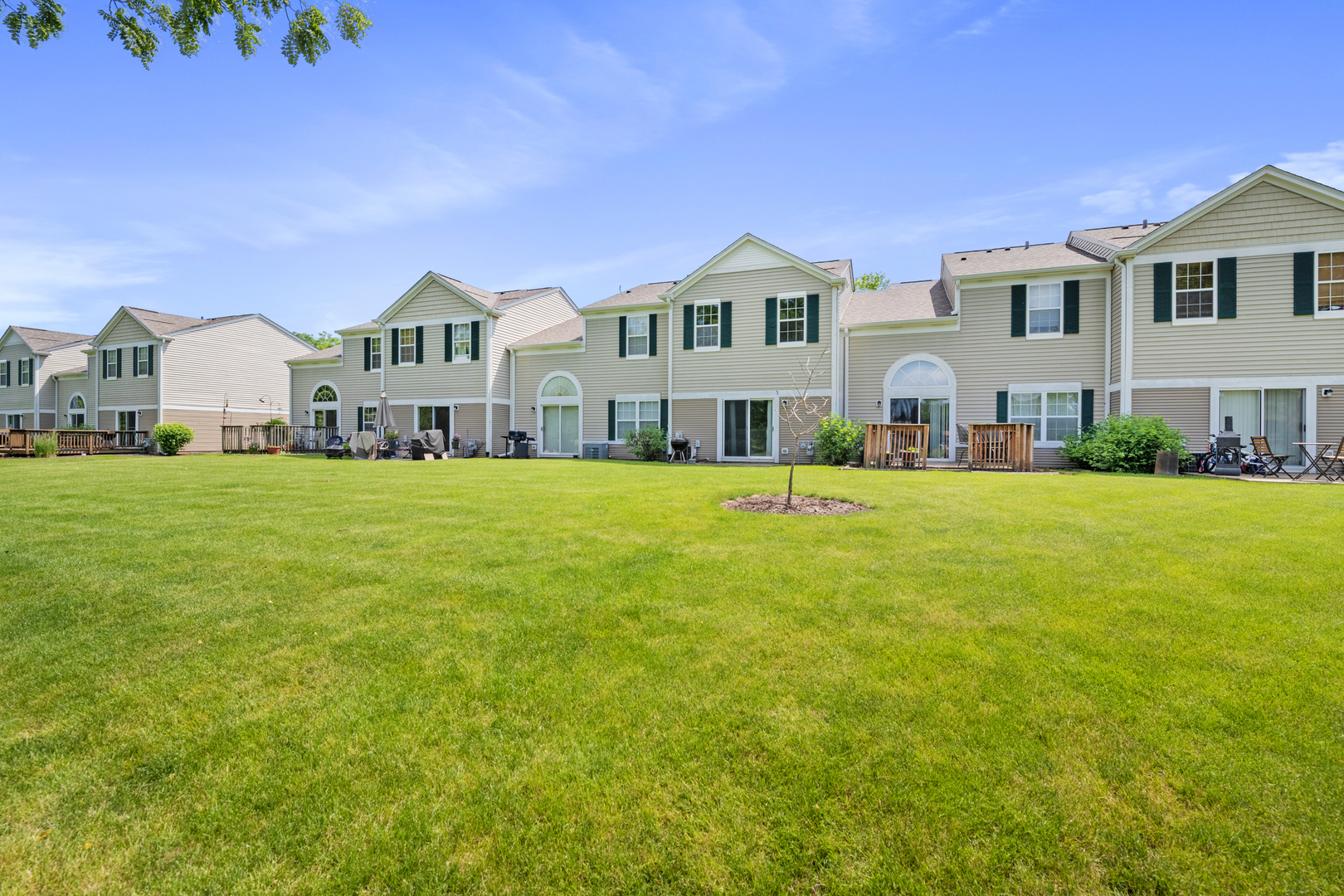 2427 Oak Tree Lane Plainfield, IL 60586 - Photo 5 of 24 a front view of a house with a yard