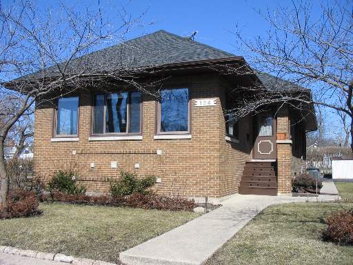 124 East Quincy Street Riverside, IL 60546 - Photo 1 of 1 a front view of a house with garden