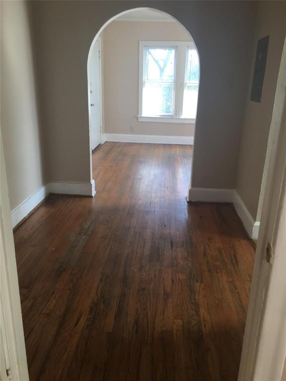 5906 Oram Street, Unit 3 Dallas, TX 75206 - Photo 7 of 10 an empty room with wooden floor and windows