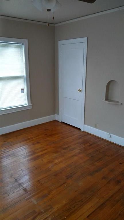 5906 Oram Street, Unit 3 Dallas, TX 75206 - Photo 10 of 10 an empty room with wooden floor and windows