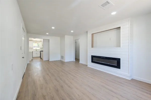 a view of a livingroom with wooden floor