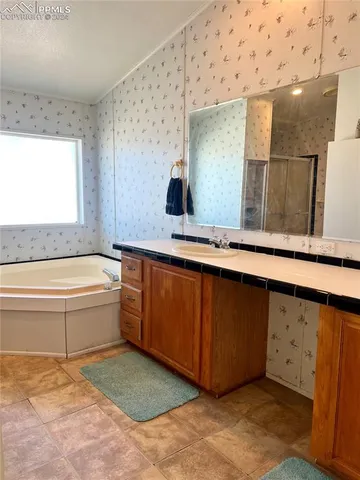 a bathroom with a bathtub and a sink