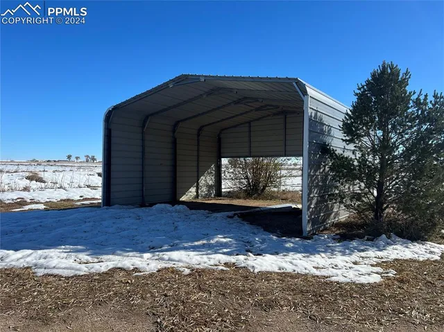 a view of a tiny house with a yard