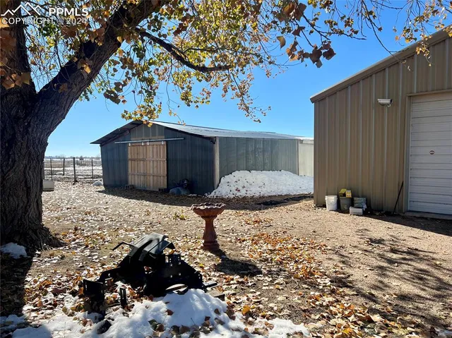 a view of a backyard of the house