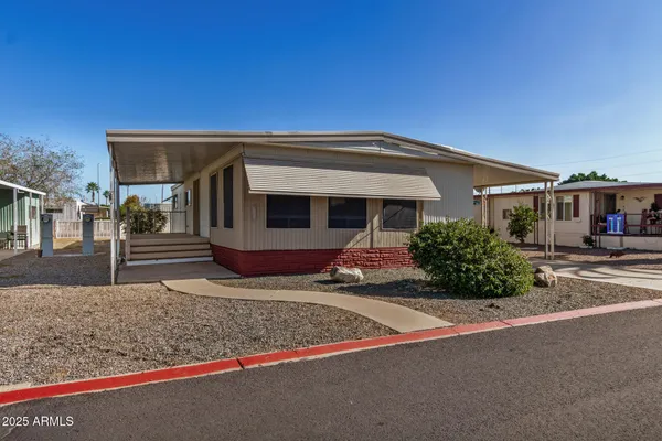 a front view of a house with garage