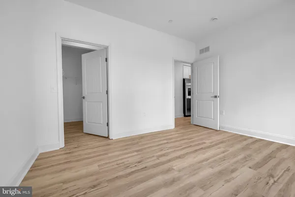 a bathroom with a shower sink and mirror